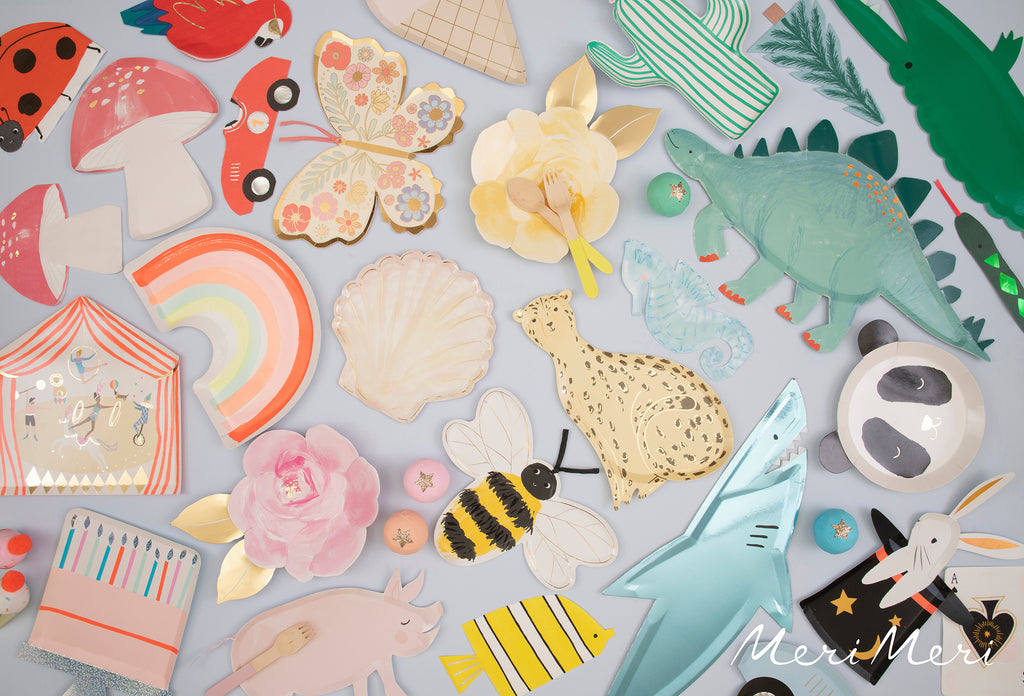 Rainbow of assorted kids birthday plates by Meri Meri, including a shark, dinosaur, bee, butterfly, toadstool, race car, circus tent and more.