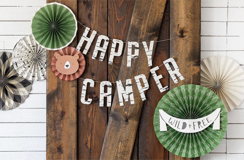adventure-party-decorative-fans-styled-with-banner