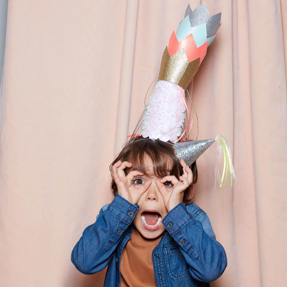 Meri-Meri-Party-Silver-Glitter-Crowns-Boy-Wearing-Tall-Stack-Of-Birthday-Party-Hats