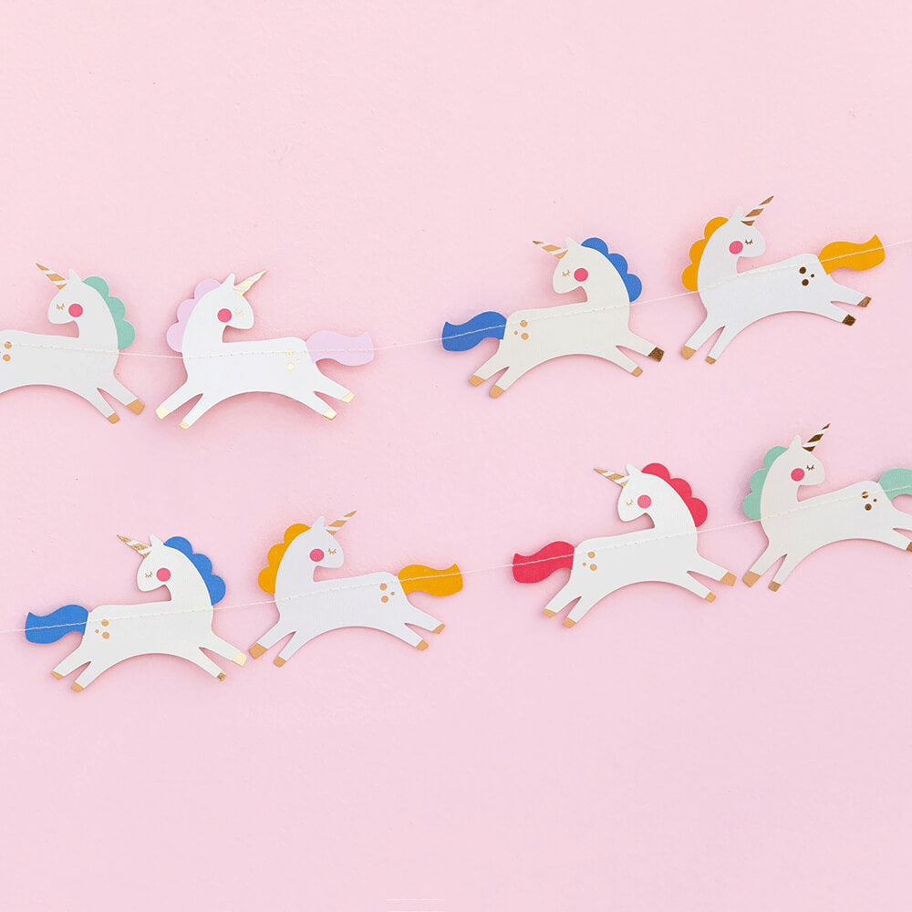 my-minds-eye-magical-unicorn-rainbow-party-banner-garland-hung-on-pink-background